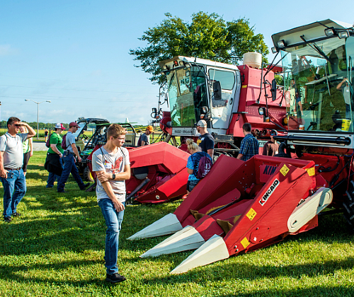 students examining farm equipment