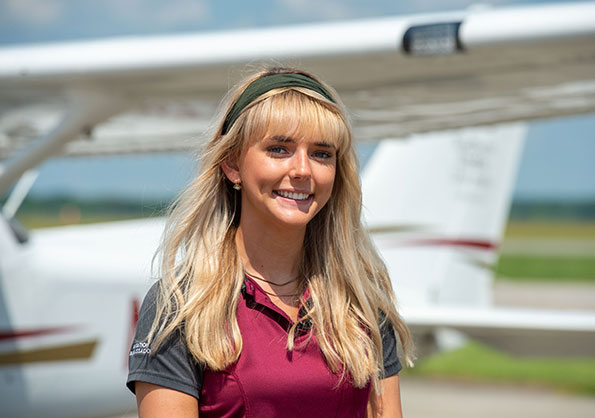 SIU Aviation Student in front of Plane