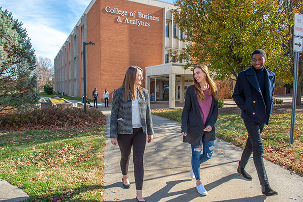 Group Business Administration Students walking on Campus