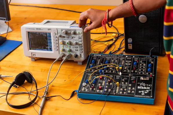 SIU Student working on control panel