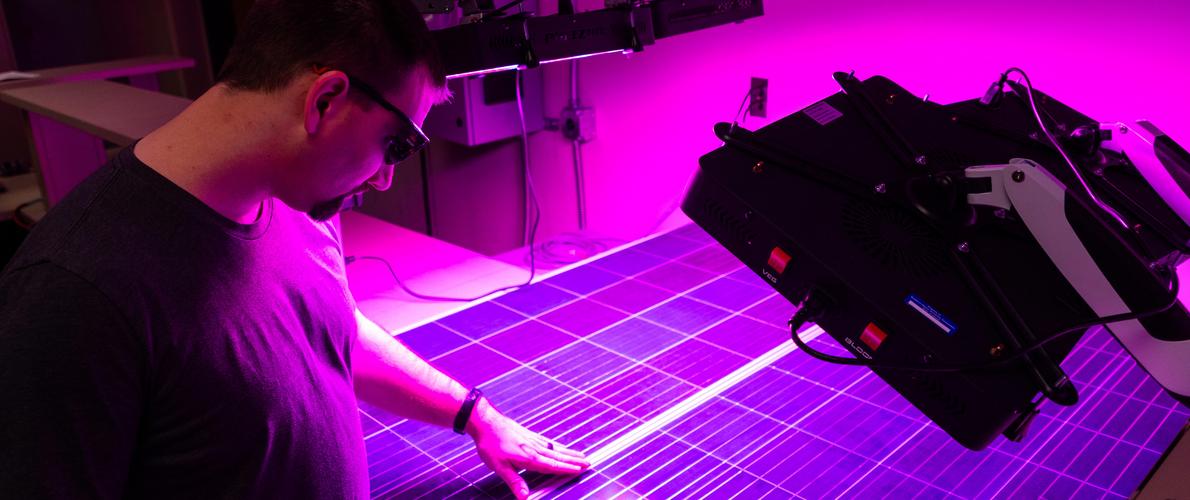 SIU Electrical and Computer Engineering student works on solar panels