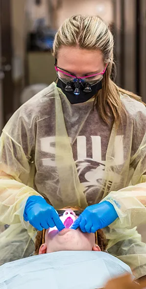 SIU Dental Hygiene Student working on a child in the Clinic