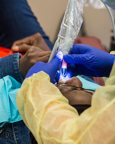 SIU Dental Hygiene Student work on a fellow student