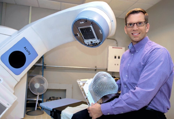 Dr. McKinnies with radiation machine