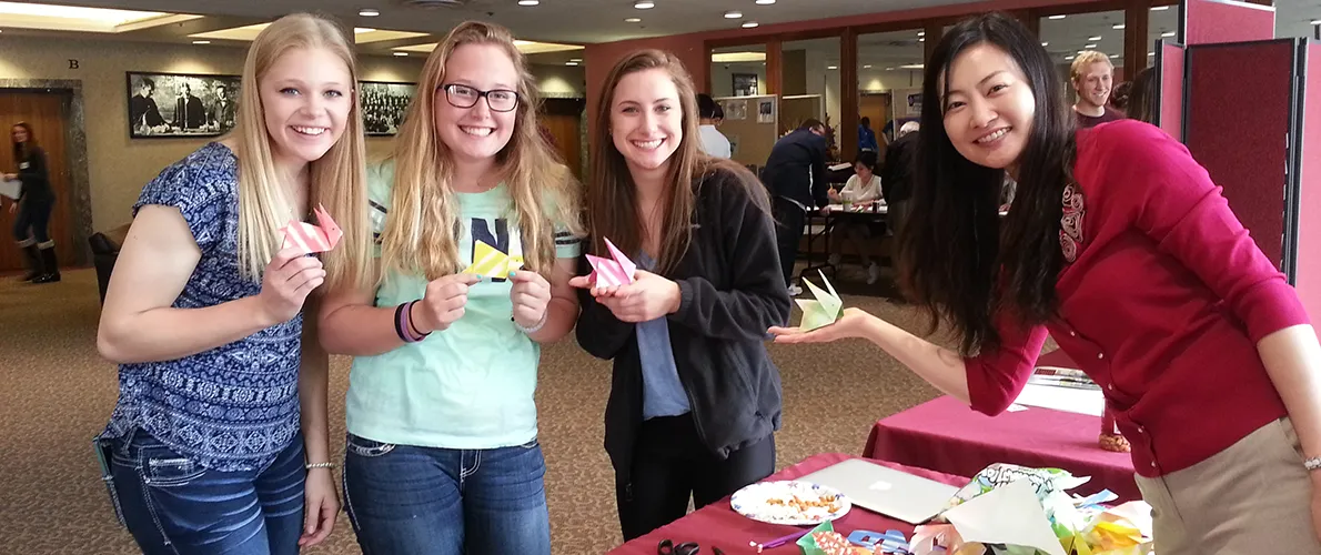 Group of SIU Students on campus creating origami