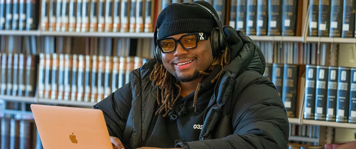 SIU Student working on computer in Library 