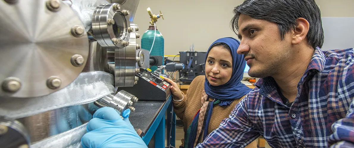 SIU Physics Students working in a lab